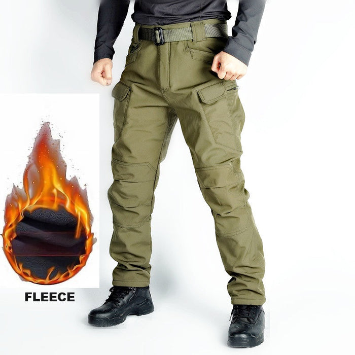 Men's tactical cargo pants in green, water-resistant soft shell with fleece lining, ideal for outdoor and tactical activities.