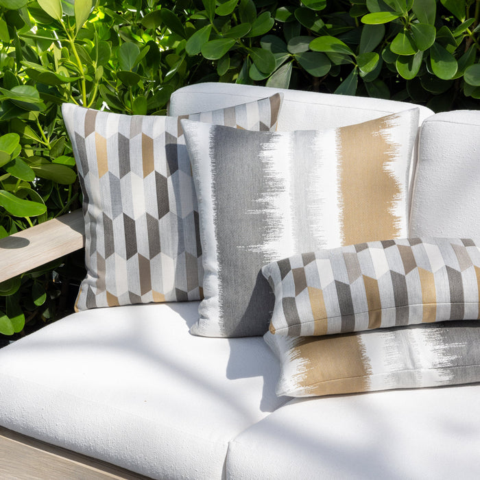 Outdoor image of pillows in Murmur Camel – outdoor-safe woven fabric by Elaine Smith, ideal for high-end commercial and residential applications.
