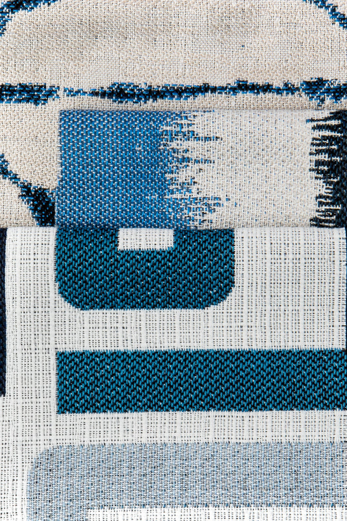 Coordinating fabrics to Gradient outdoor-safe fabric in midnight blues and soft white – Murmur Midnight by Elaine Smith