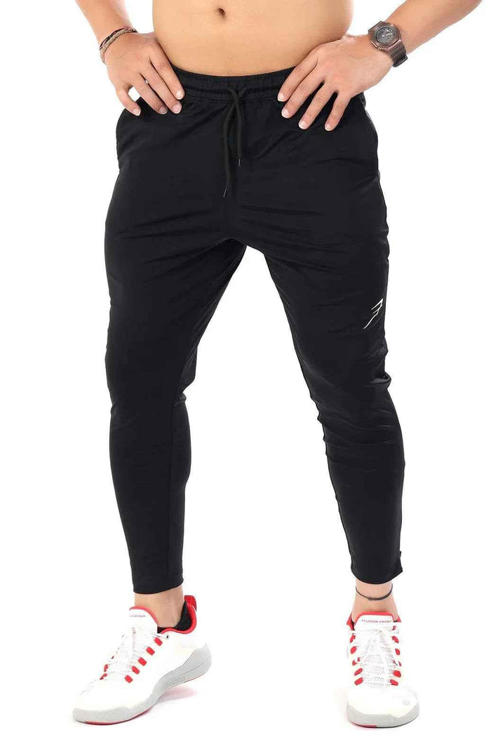 Black Nylon Supreme Tracks by Fuaark Nz, stylish athletic track pants with a sleek design and comfortable fit.