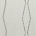 Detail image of Minimalist black linear geometric pattern woven into textured boucle outdoor safe fabric