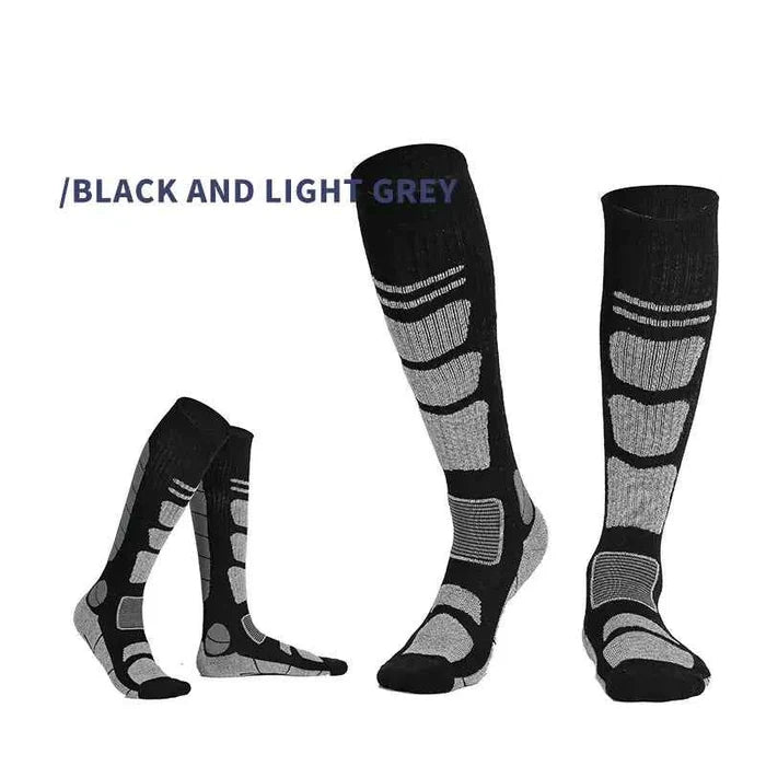 Dark grey and black over-the-knee wool hiking socks by Mead's Supply & Equipment for outdoor adventures and trail walking.