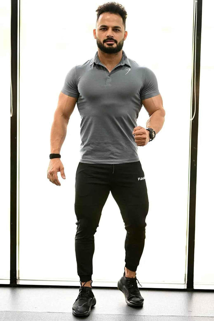 Grey Polo T-shirt from Fuaark Nz featuring a classic collar and short sleeves, displayed on a plain background.