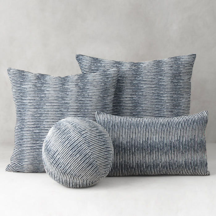Set of striped cushions on a neutral background