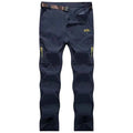 Black and grey men's quick-drying outdoor hiking pants by Mead's Supply & Equipment, waterproof, anti-UV, and breathable trekking gear.