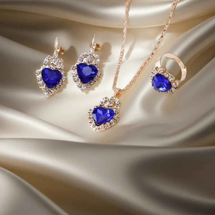 Stylish 3Sixty5 jewelry set with royal blue rhinestone splash design, featuring a heart-shaped piece and matching accessories.