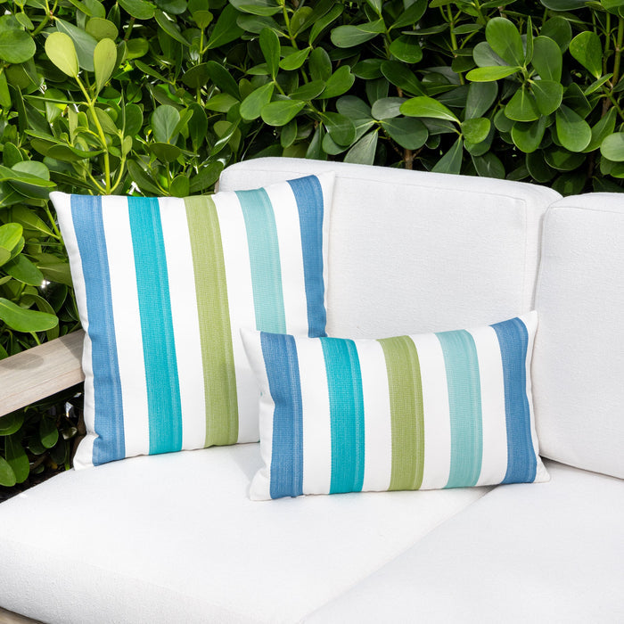 Outdoor image of pillows in Outdoor safe woven fabric with vibrant green, blue, and white stripes – Rhodes Stripe by Elaine Smith