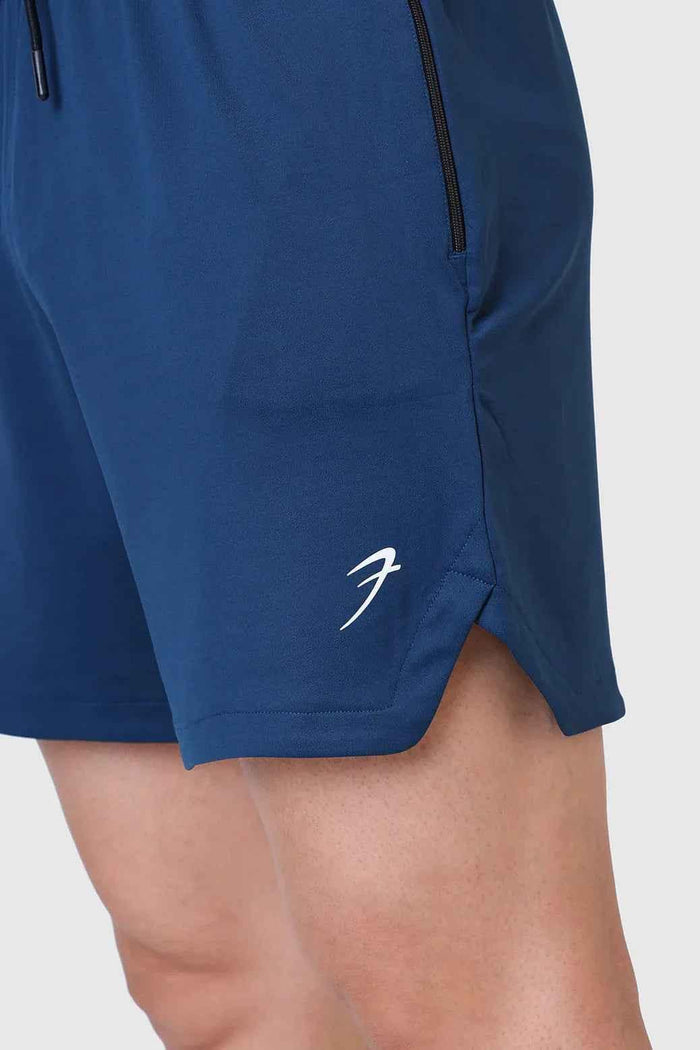 Fuaark Nz Rush Shorts in teal color, casual shorts with a comfortable fit, shown on a model.
