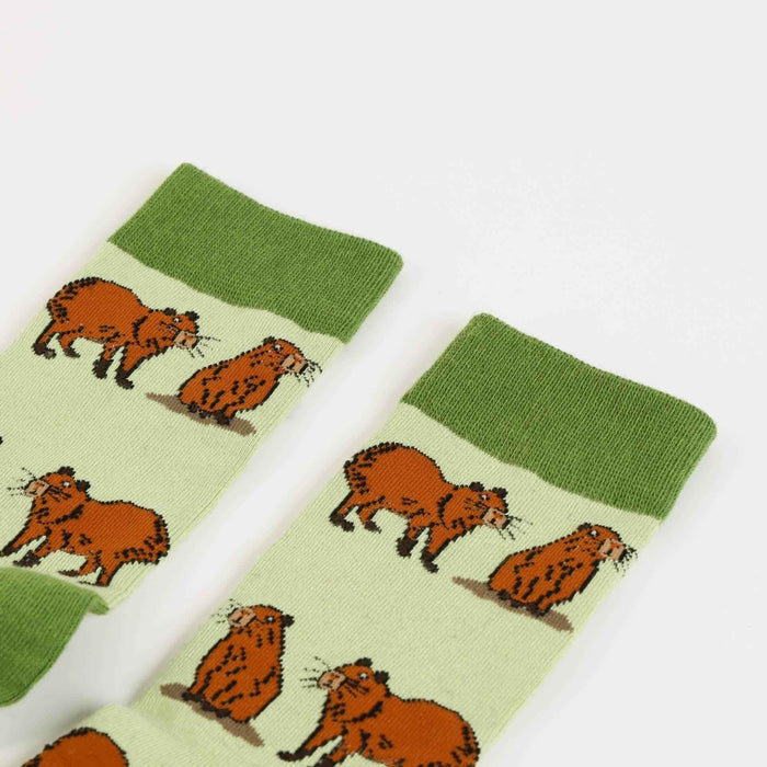 Bundles of Barekind NZ Save the Green Capybara bamboo socks showcasing soft, eco-friendly socks with green capybara design.