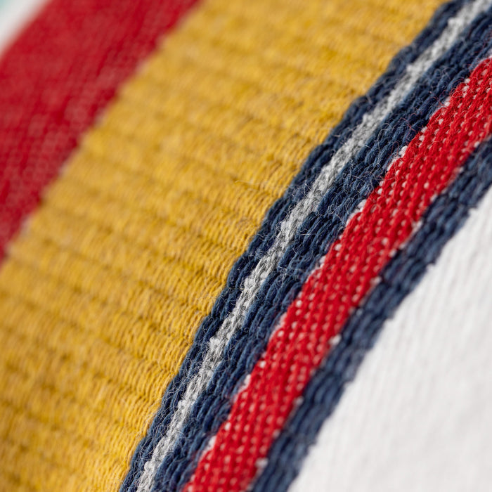 Close-up of fabric with red, blue, and yellow stripes.