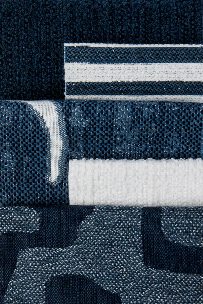 Coordinating fabrics to Sophisticated stripe in deep denim on ivory boucle ground outdoor safe woven fabric