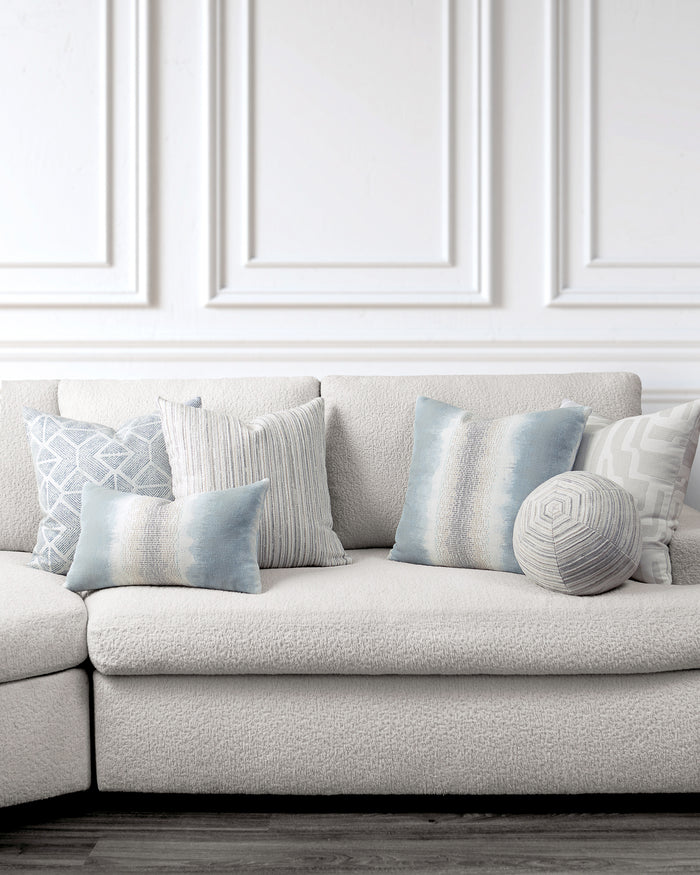 indoor environmental image of sky blue white and gray coordinated pillow group by Elaine