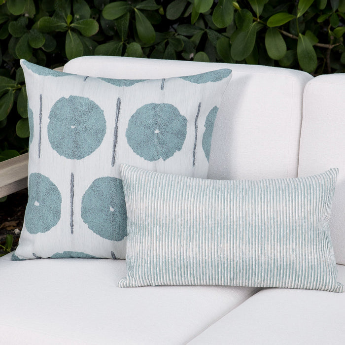 Outdoor image of pillows in Outdoor safe fabric with circular watercolor motif in mist blue tones