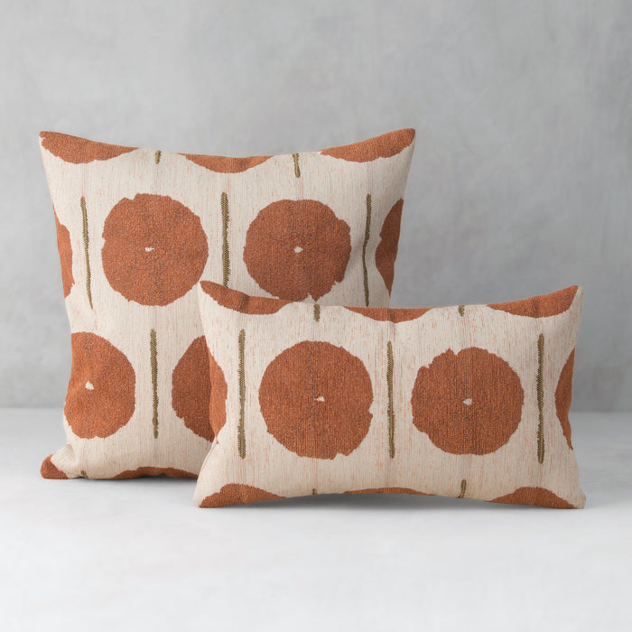Two patterned pillows on a gray background
