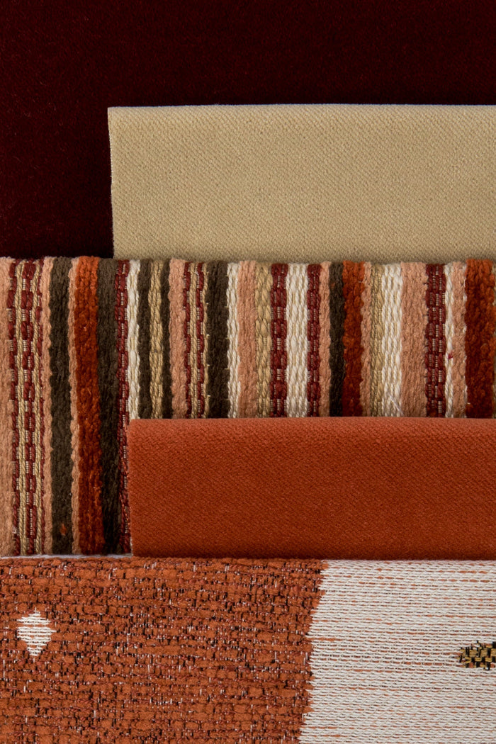 Coordinating fabrics to Artful circle motif in papaya orange on outdoor-safe fabric – Solstice Papaya by Elaine Smith