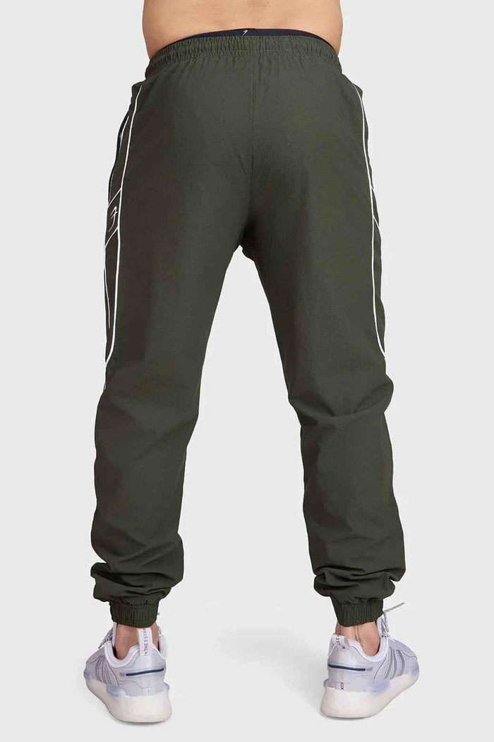 Fuaark Nz Sprint Joggers Army green track pants with elastic waistband and tapered fit, suitable for athletic or casual wear.