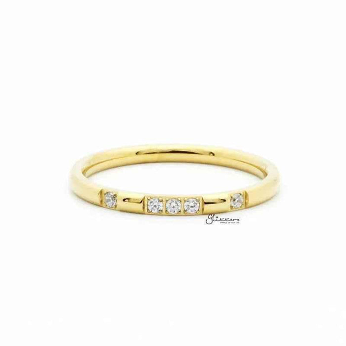 Gold stainless steel band ring with five CZ inlays, featuring a sleek design by Glitters.