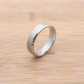 Silver stainless steel 6mm wide beveled edge band ring with a sleek, polished finish from Glitters.