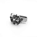 Stainless steel men's ring featuring antiqued multi skull head design by Glitters, with a bold, detailed casting style.