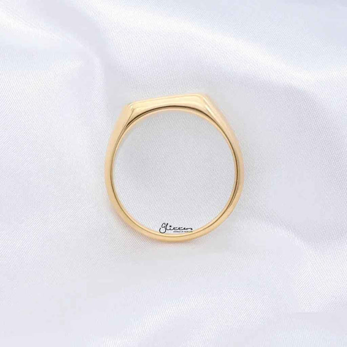 Gold stainless steel rectangle signet ring from Glitters, showcasing a sleek, polished design on a clean background.