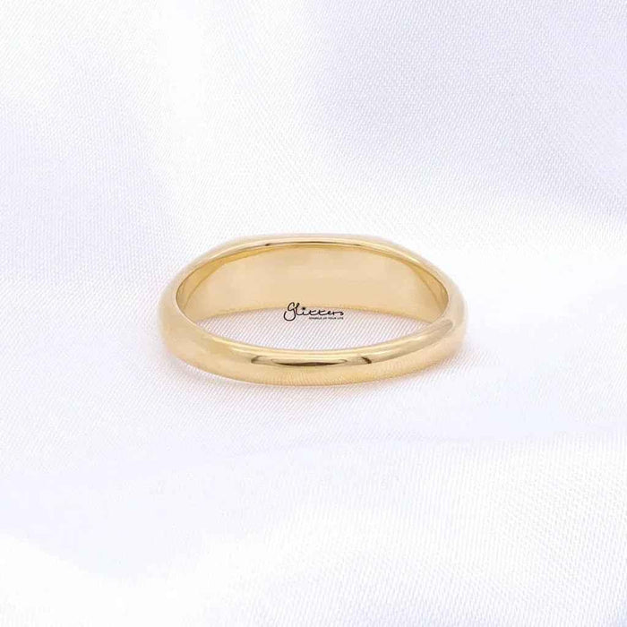 Gold stainless steel rectangle signet ring by Glitters, showcasing a sleek, polished design with a bold rectangular face.