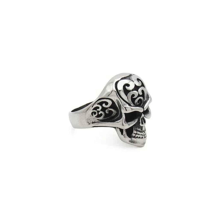 Stainless steel skull ring with tribal carved design, featuring detailed skull and tribal patterns, by Glitters.