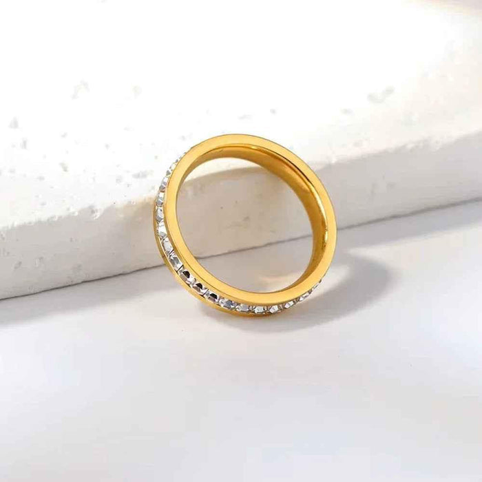 Gold stainless steel square CZ paved band ring by Glitters, showcasing a sleek geometric design with sparkling stones.