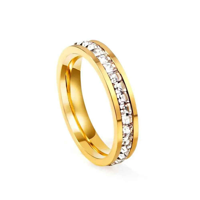 Gold stainless steel square CZ paved band ring from Glitters, featuring a modern geometric design and sparkling stone accents.