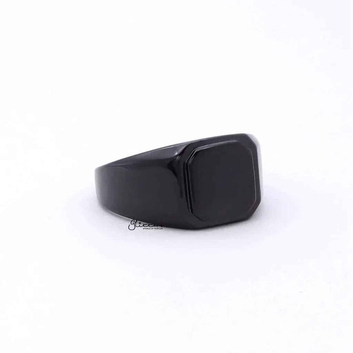 Black stainless steel square flat top signet ring by Glitters, showcasing a sleek, modern design with a polished finish.