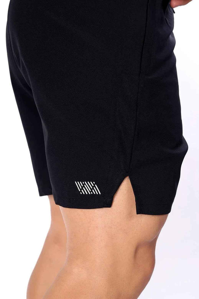 Black Fuaark Nz Studio Shorts laid flat, showcasing their sleek design and comfortable fit for casual or athletic wear.