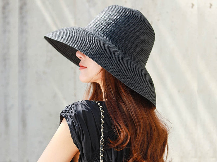 White wide brim floppy straw hat by dealonline.co.nz, perfect for summer beach outings and sun protection.