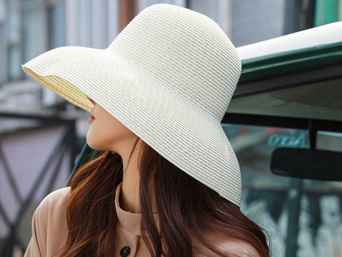 White wide brim floppy straw hat by dealonlinenz, perfect for summer beach days and sun protection.