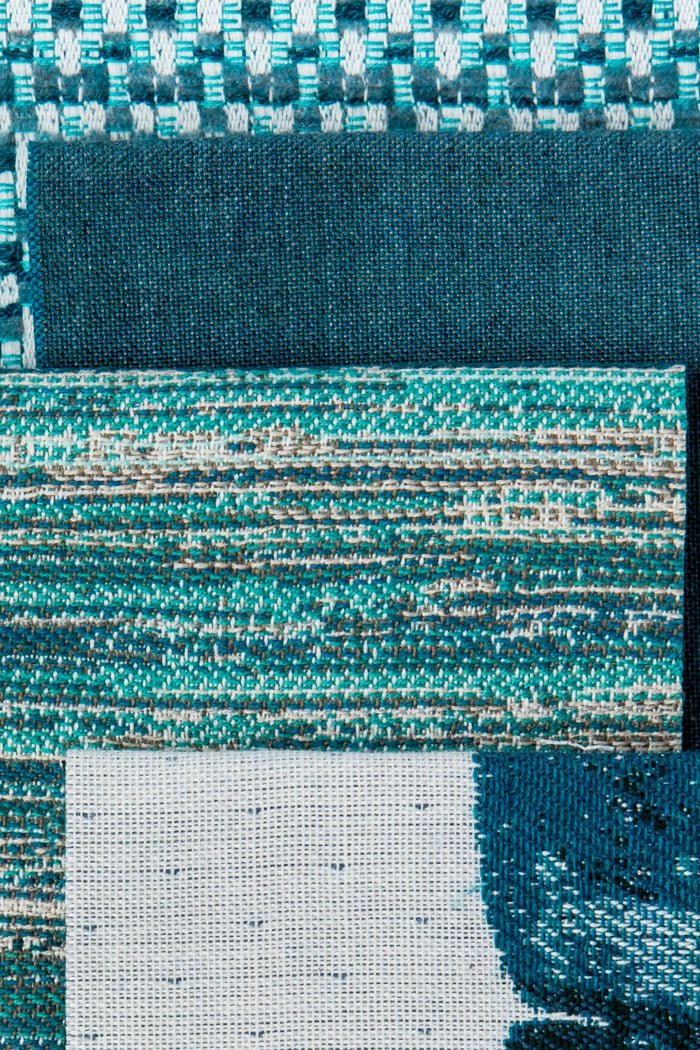 Coordinating fabrics to Lagoon-toned outdoor-safe fabric with textured vertical streaks