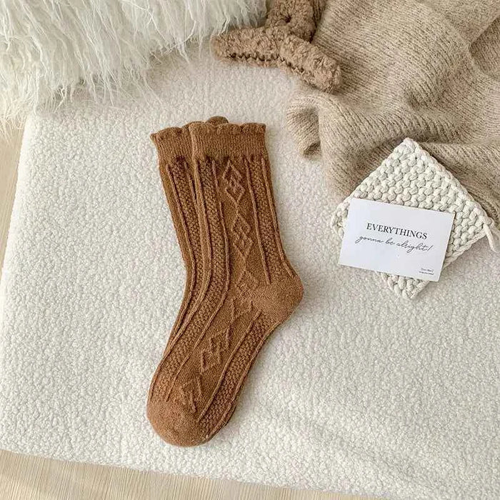 Thick diamond-shaped wool mid-thigh socks for women, warm cozy leg warmers suitable for fall and winter by Mead's Supply & Equipment.