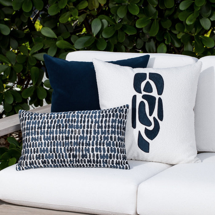 Luxury soft gray botanical patterned bolster pillow on a rooftop seating area, featuring soft touch performance weave for residential and commercial interiors