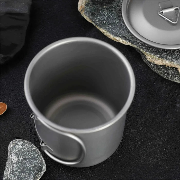 Titanium folding camping cup with lid, lightweight and collapsible travel mug for outdoor camping and hiking by Mead's Supply & Equipment