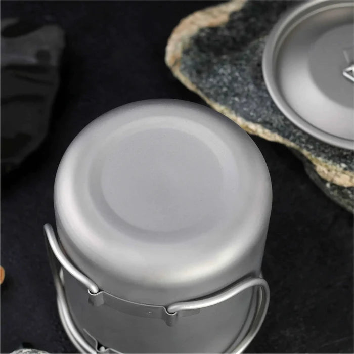 Titanium folding camping cup with lid, lightweight and collapsible outdoor travel mug for camping and hiking by Mead's Supply.