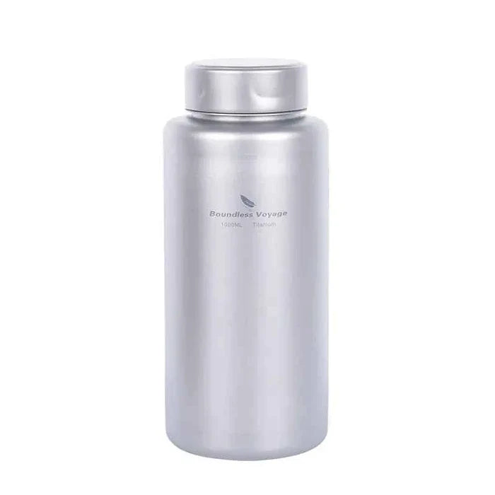 Silver titanium outdoor water bottle by Mead's Supply, 1000ml lightweight camping flask, leak-proof hiking drinkware.