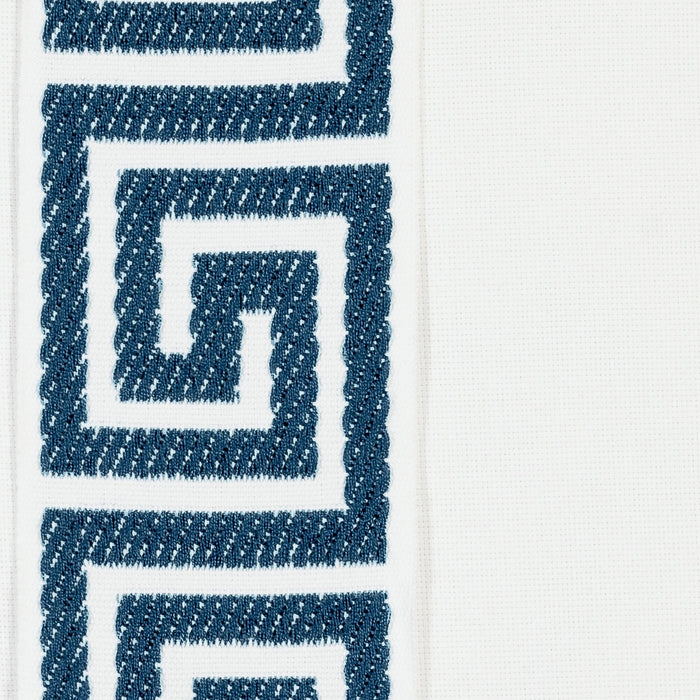 Detail image of White pillow with teal greek key band in square size for indoor and outdoor décor