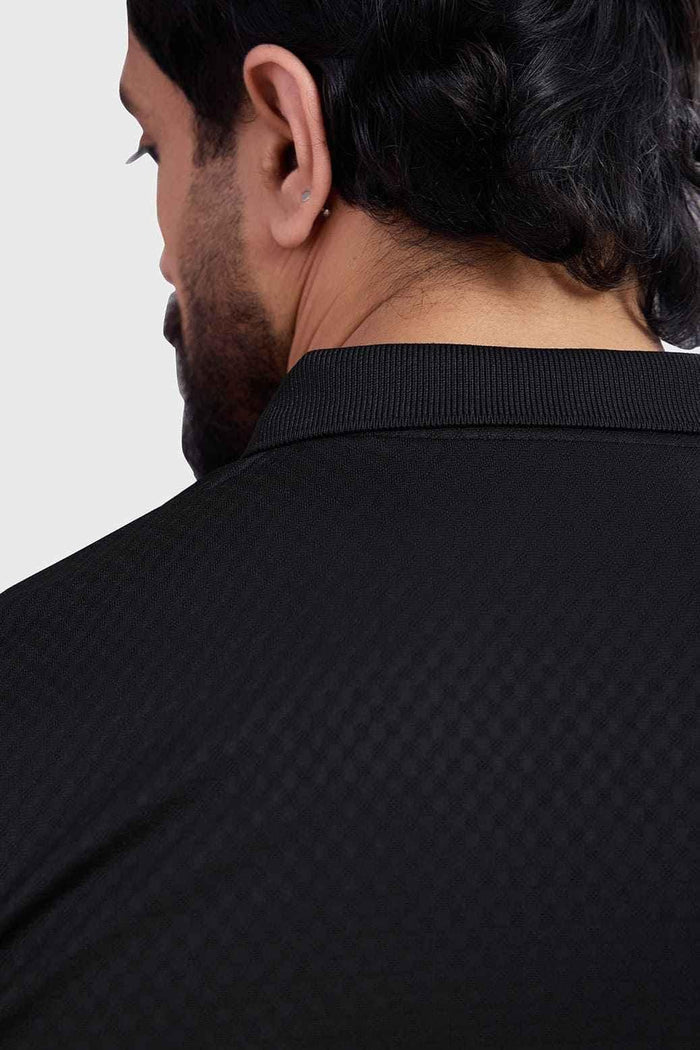 Black Wave Polo T-shirt by Fuaark NZ featuring a classic collar, short sleeves, and a sleek, modern design.