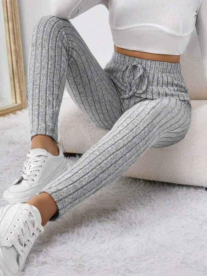 Black women's Chic-Stretch Yoga Pants by Stylish 3Sixty5, featuring a sleek fit and comfortable stretch fabric.